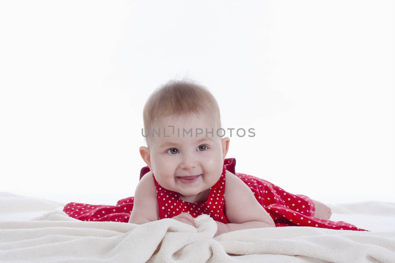 portrait of sweet little baby girl with a blanket - isolated on white