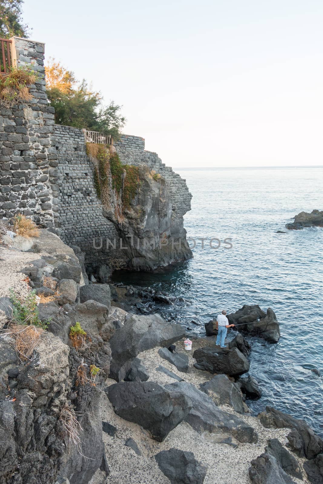 fisherman on the rocks ionian sea a