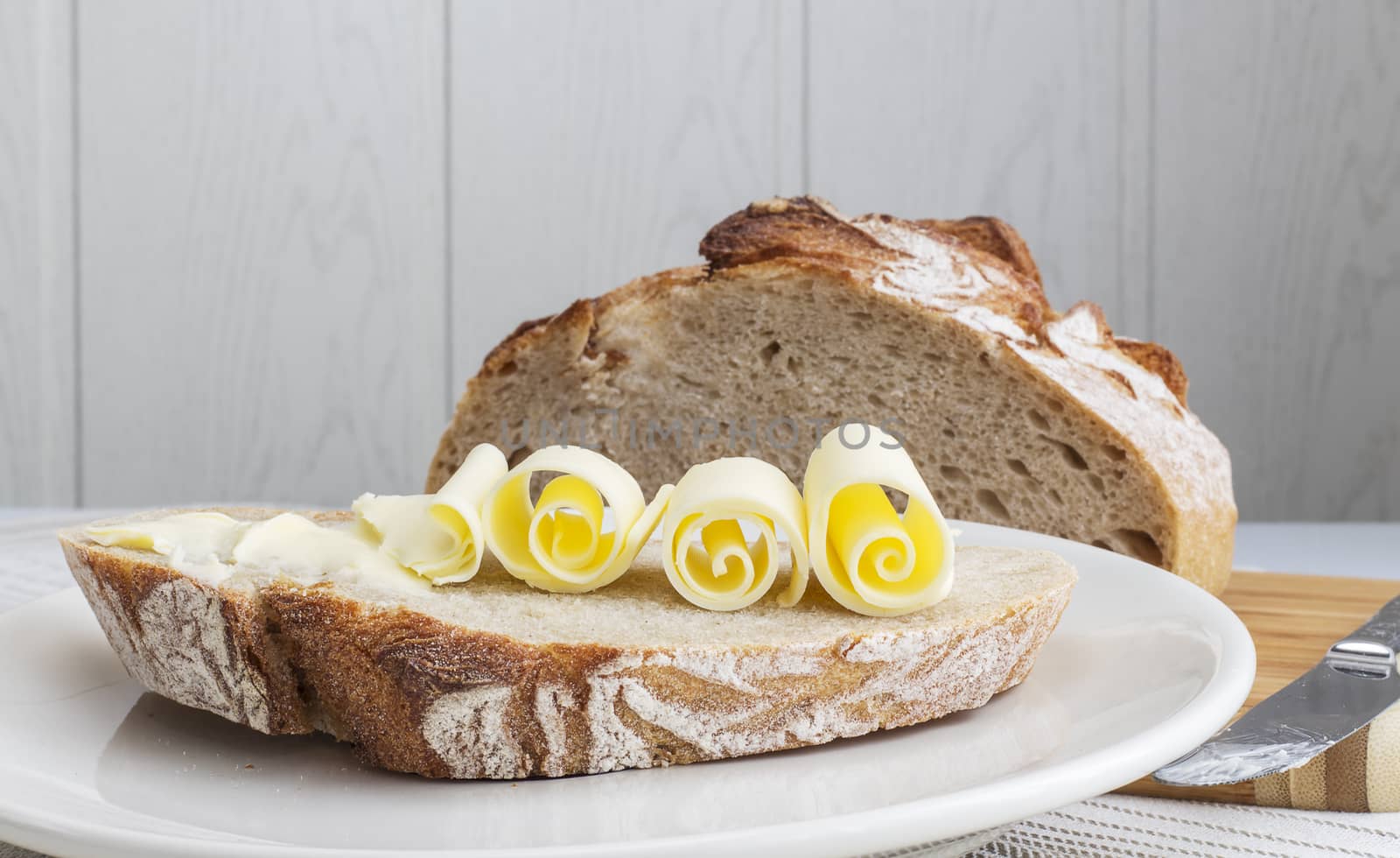bread with butter on a plate