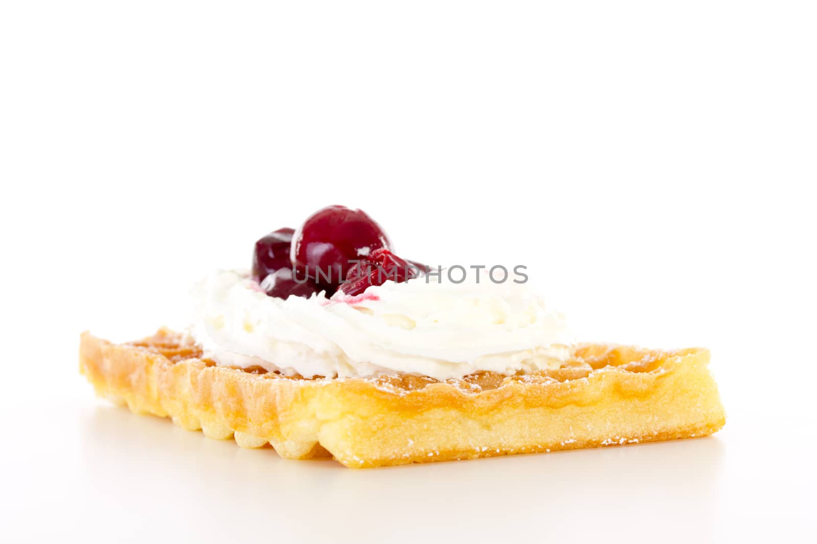 Brussels waffle with whipping cream and sour cherries by gwolters