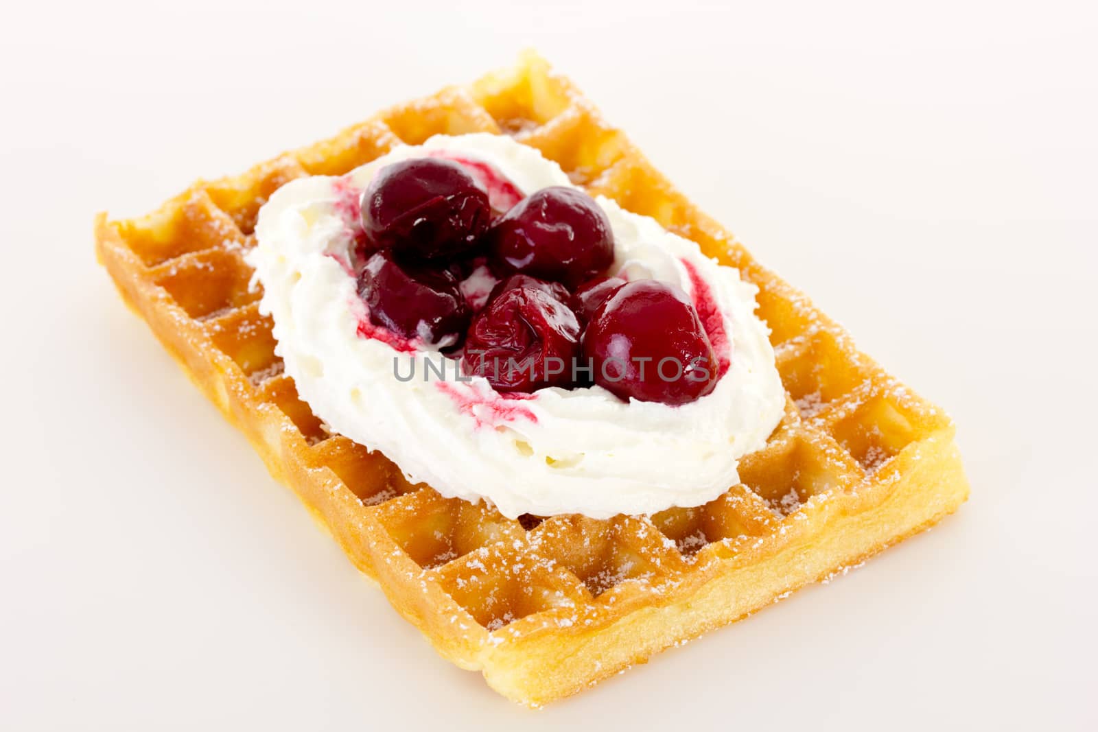 Waffle with cream and cherries by gwolters