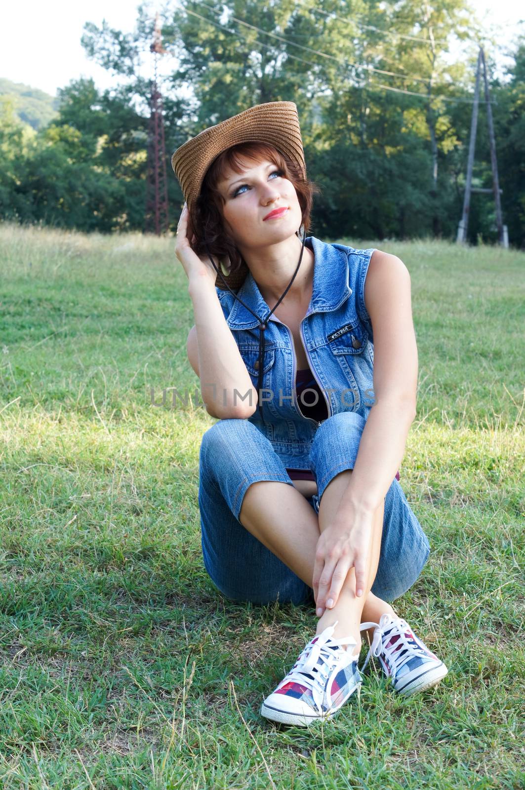 The girl in a hat on walk