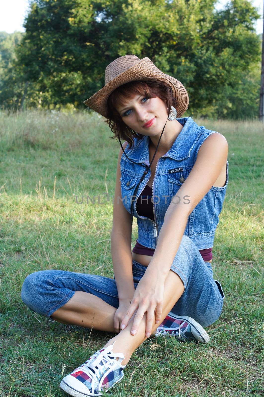 The girl in a hat on walk