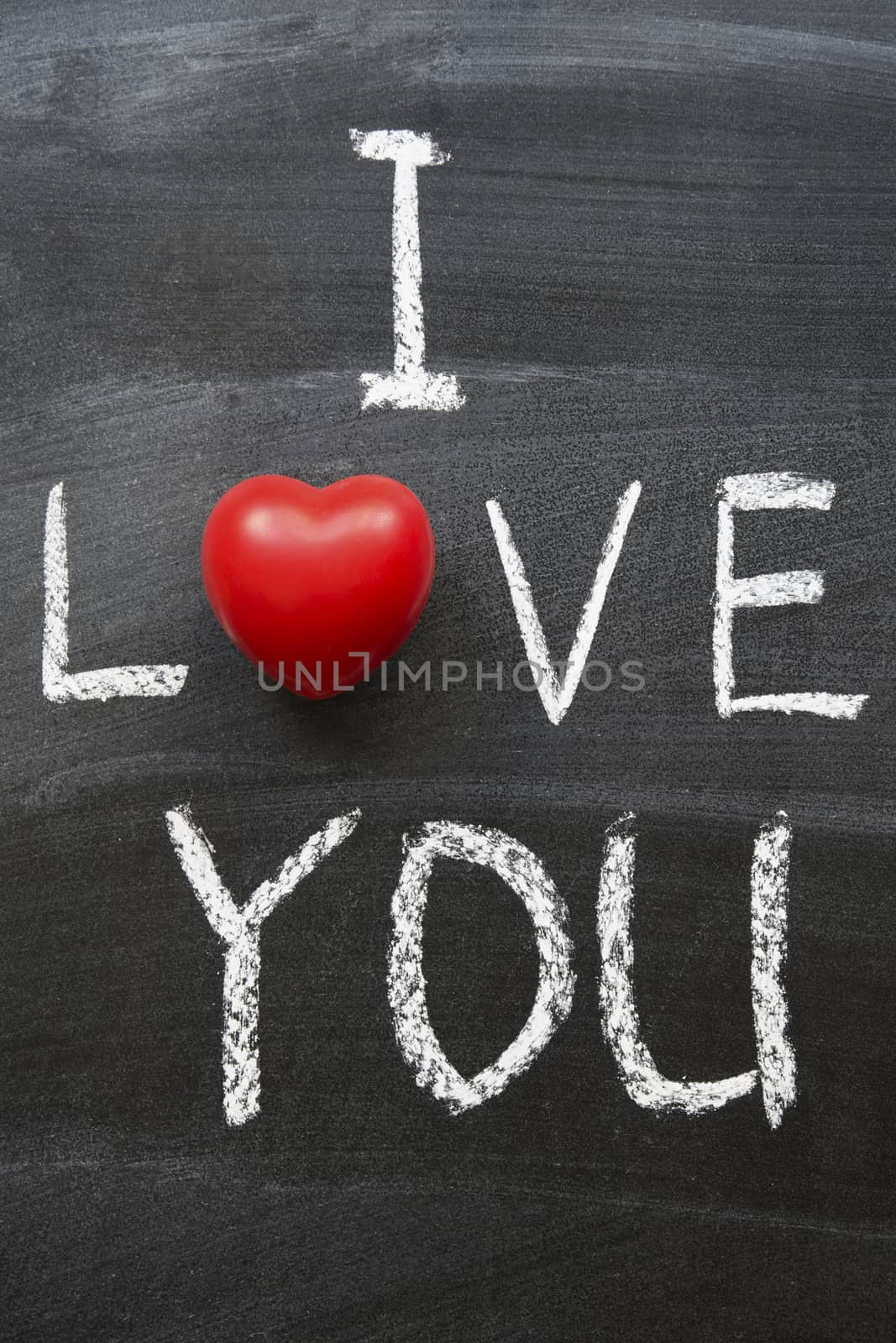I love you phrase combined from handwritten symbols and red heart object