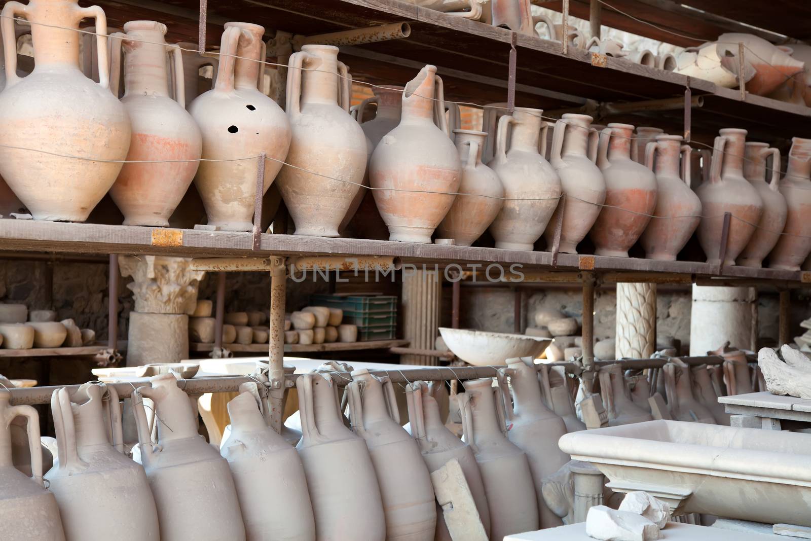 Pompeii antique pottery jugs. The city of Pompeii was an ancient Roman city. The eruption killed the city's inhabitants and buried it under tons of ash.