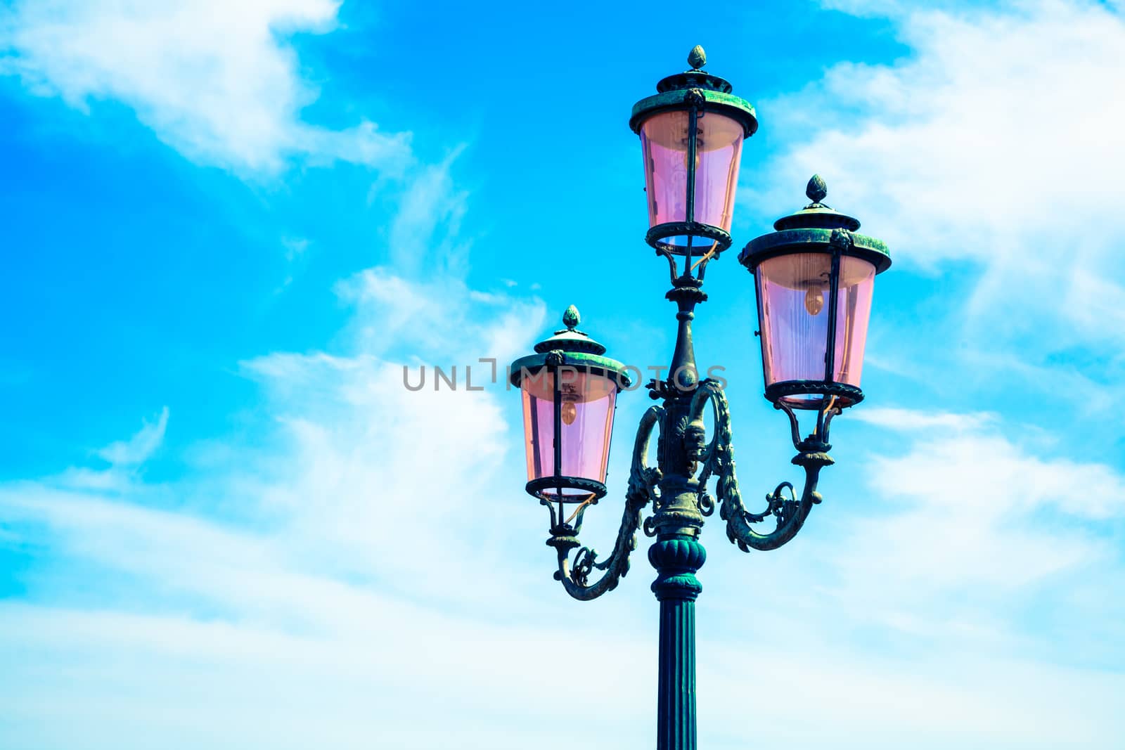 old street-lamp on blue sky
