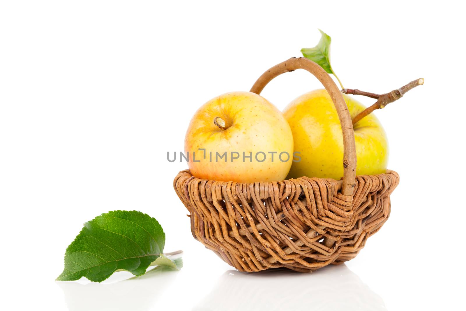 apple in a basket on white background