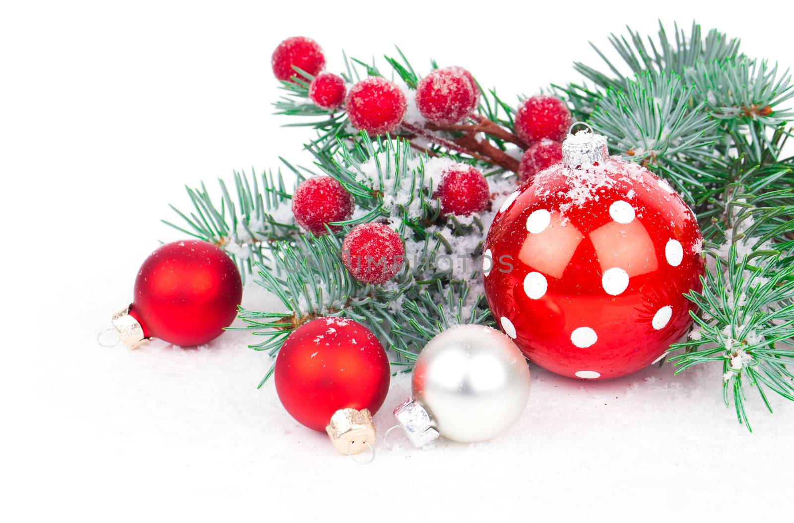 Christmas balls and fir branches with decorations isolated over white