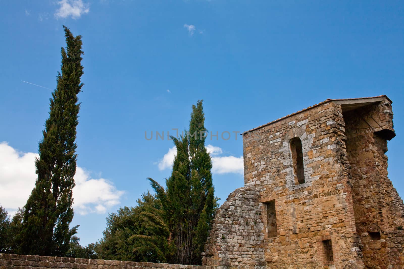 An old medieval building and ruins in San Quirico d'Orcia
