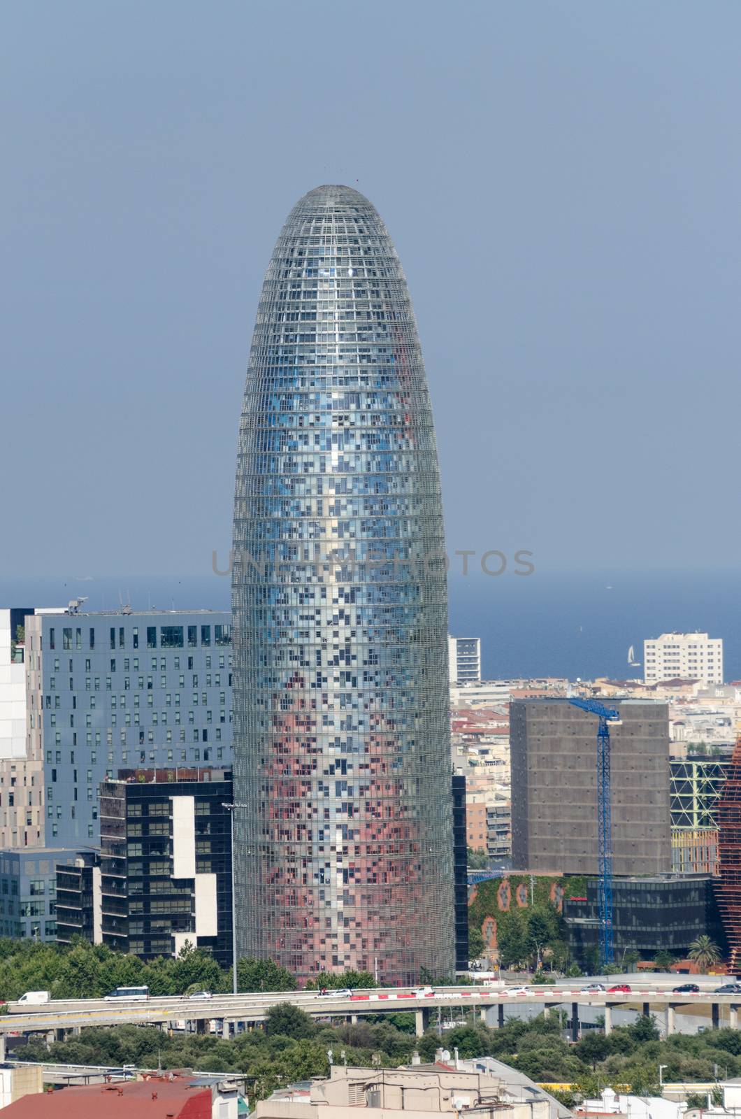 BARCELONA, SPAIN - JUNE 10: Torre Agbar in financial district of Barcelona, 38-story tower in Barcelona at June 10, 2012. The tower has a total of 50693 square meters, of which 30000 are in offices.