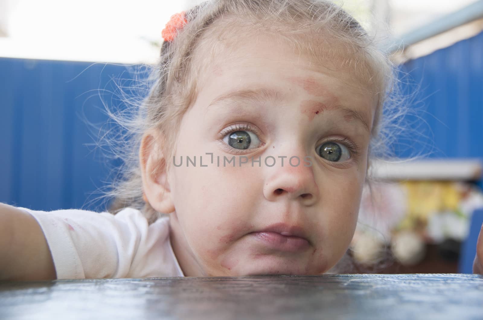 The girl ate berries astonishment looked at the picture. portrait