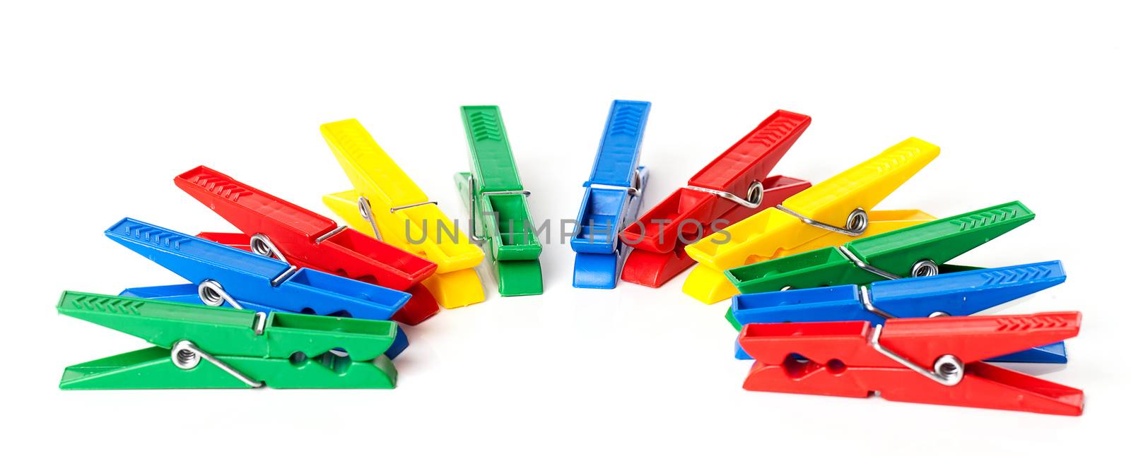 Closeup image of colorful clothespins isolated on a white background