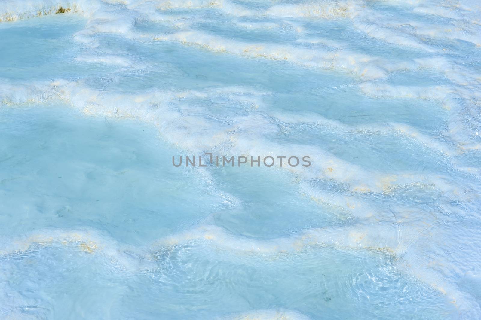 Blue pools and white travertine terraces at Pamukkale, Turkey 