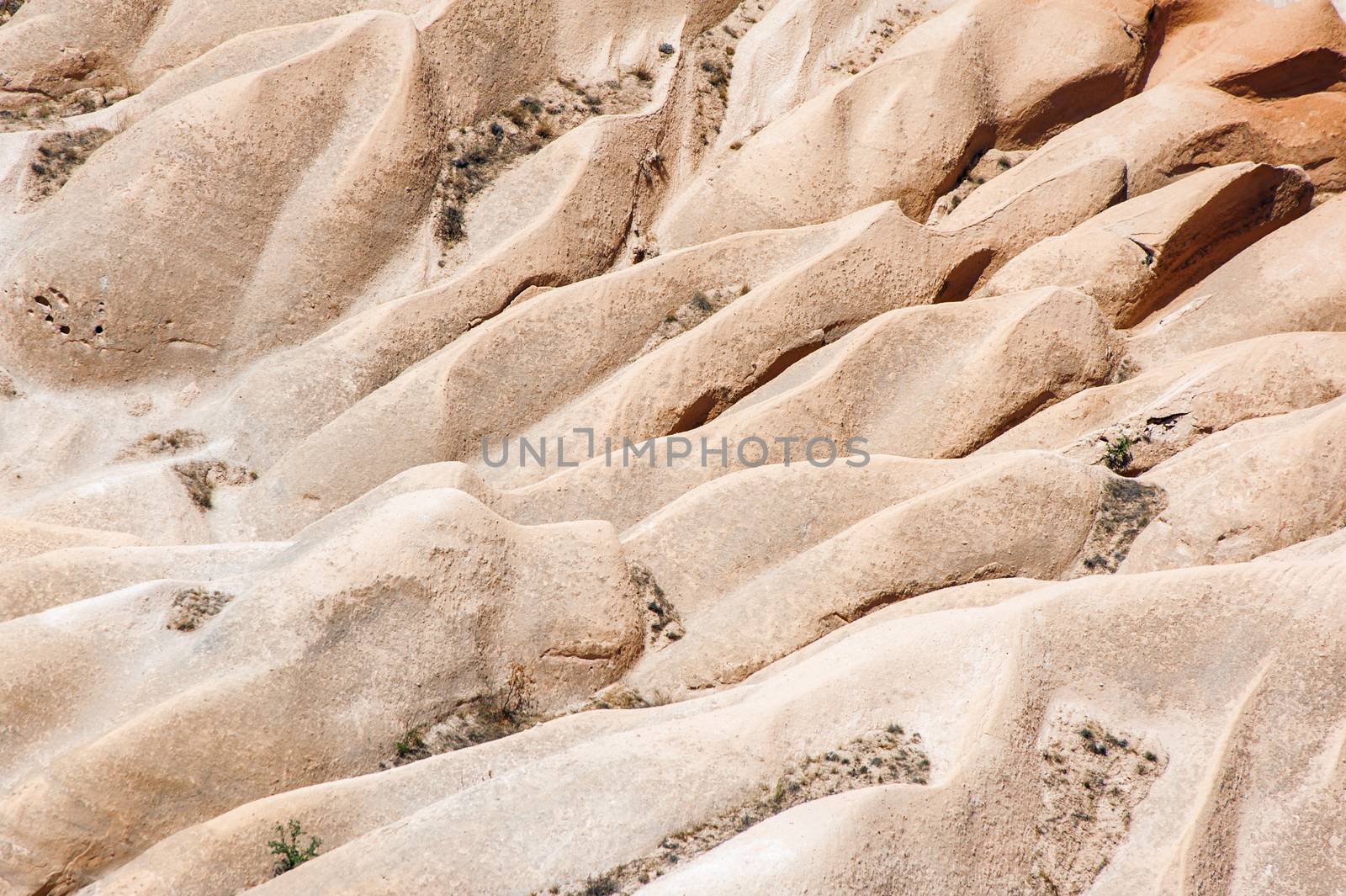 Detailed photo of vivid pink rock formations from above in Cappadocia, Turkey