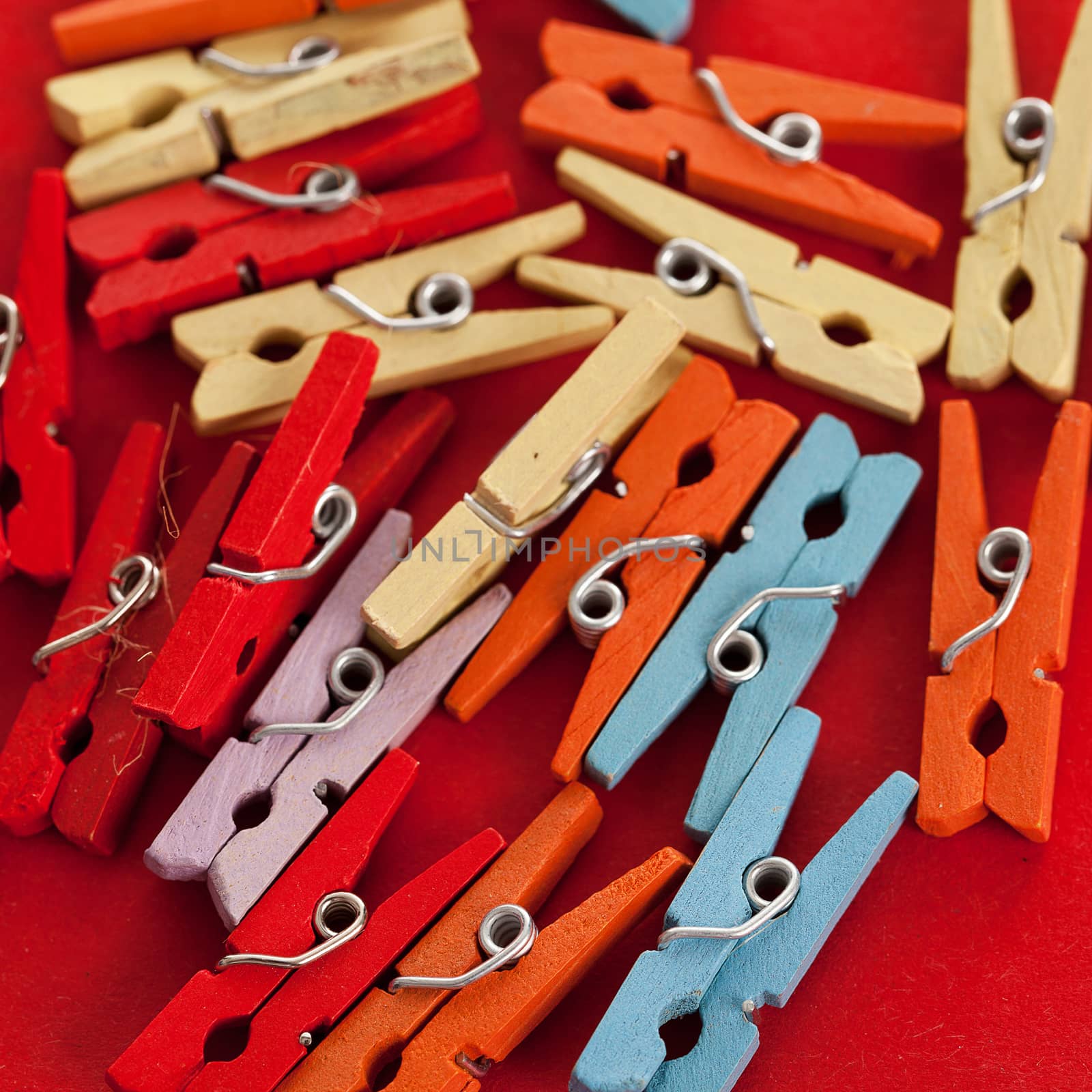 Closeup image of colorful office clothespins by rufatjumali