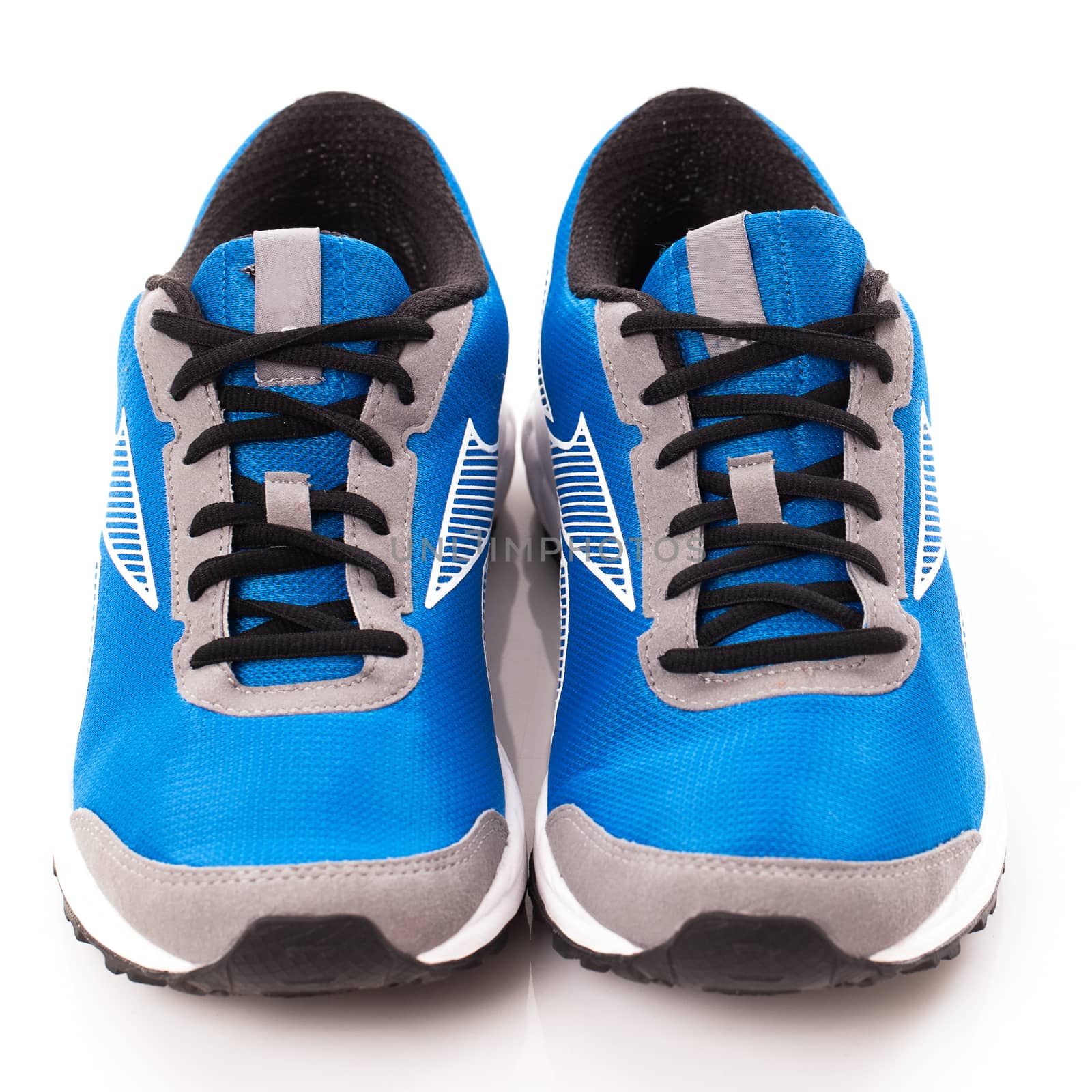 Picture of a pair of blue trainers over a white background