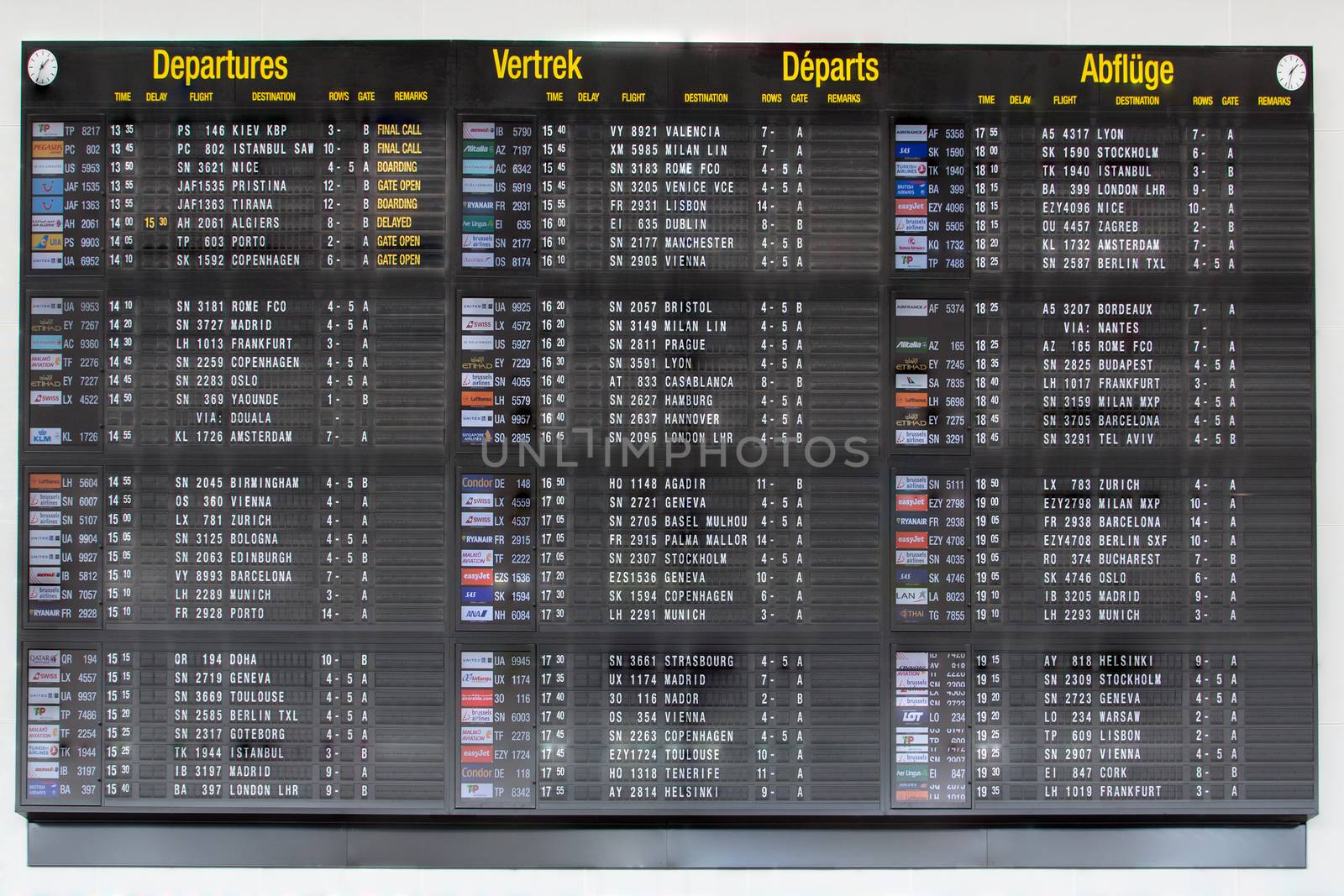 Airport departure board in terminal with flight information