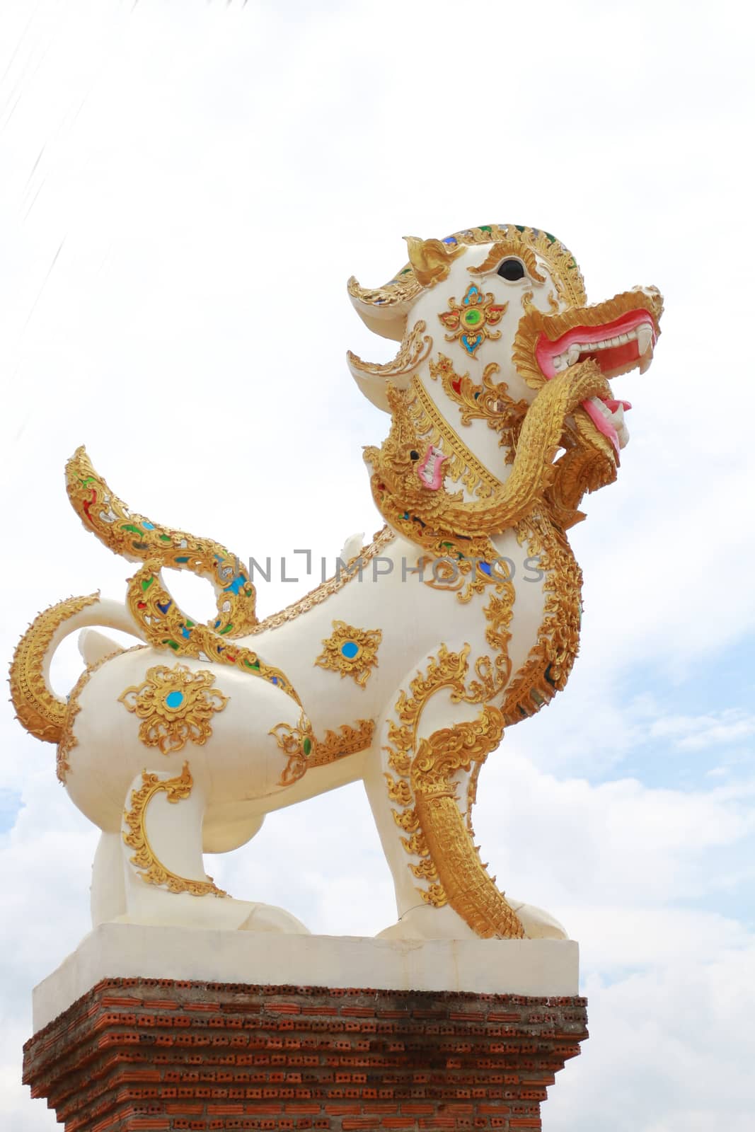 Lion in Buddhist religion have naga  in mouth.Siting at the entrance of temple.