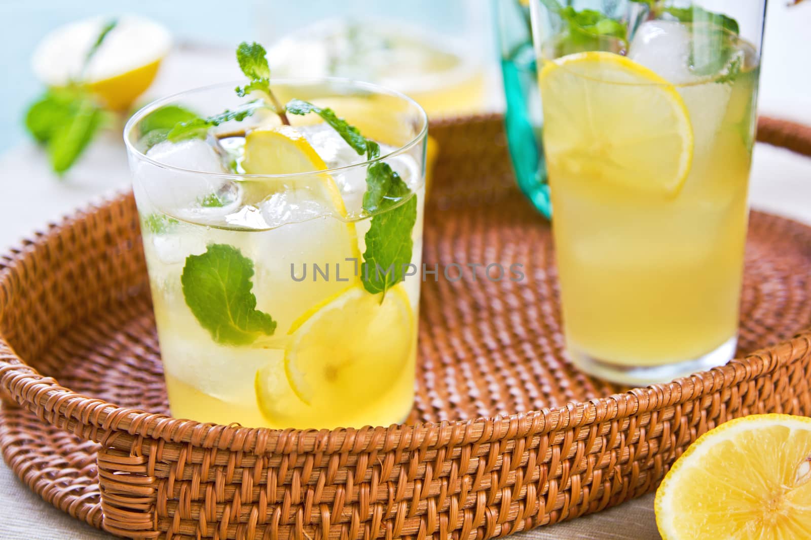 Lemonade with fresh lemon and mint by lemon reamer