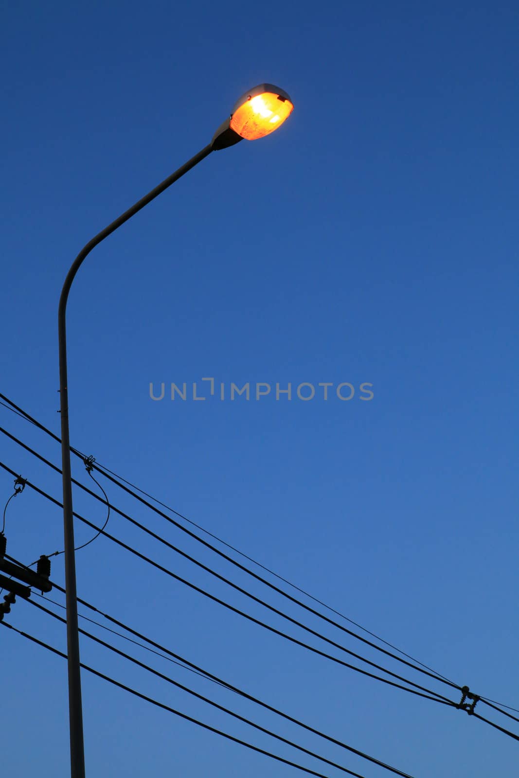 The streetlamp turn on the light automatically when dark.