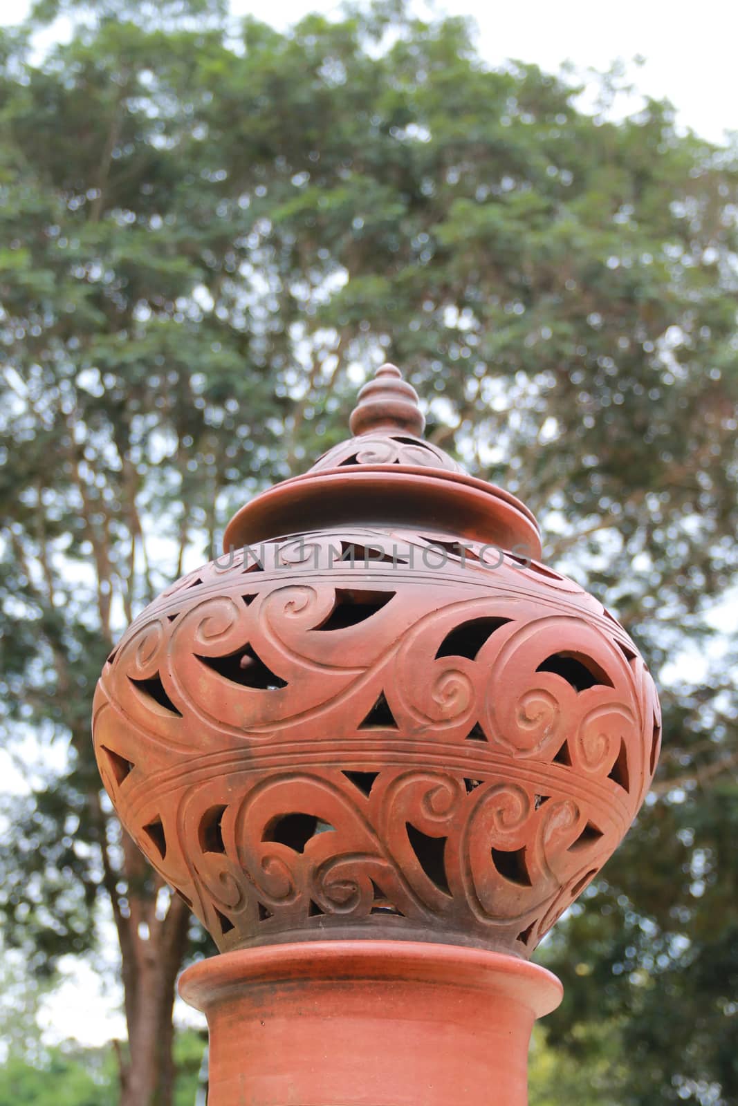 Thai pottery lamps are decor on the poles.This folk artwork is common apparent in Thailand.
