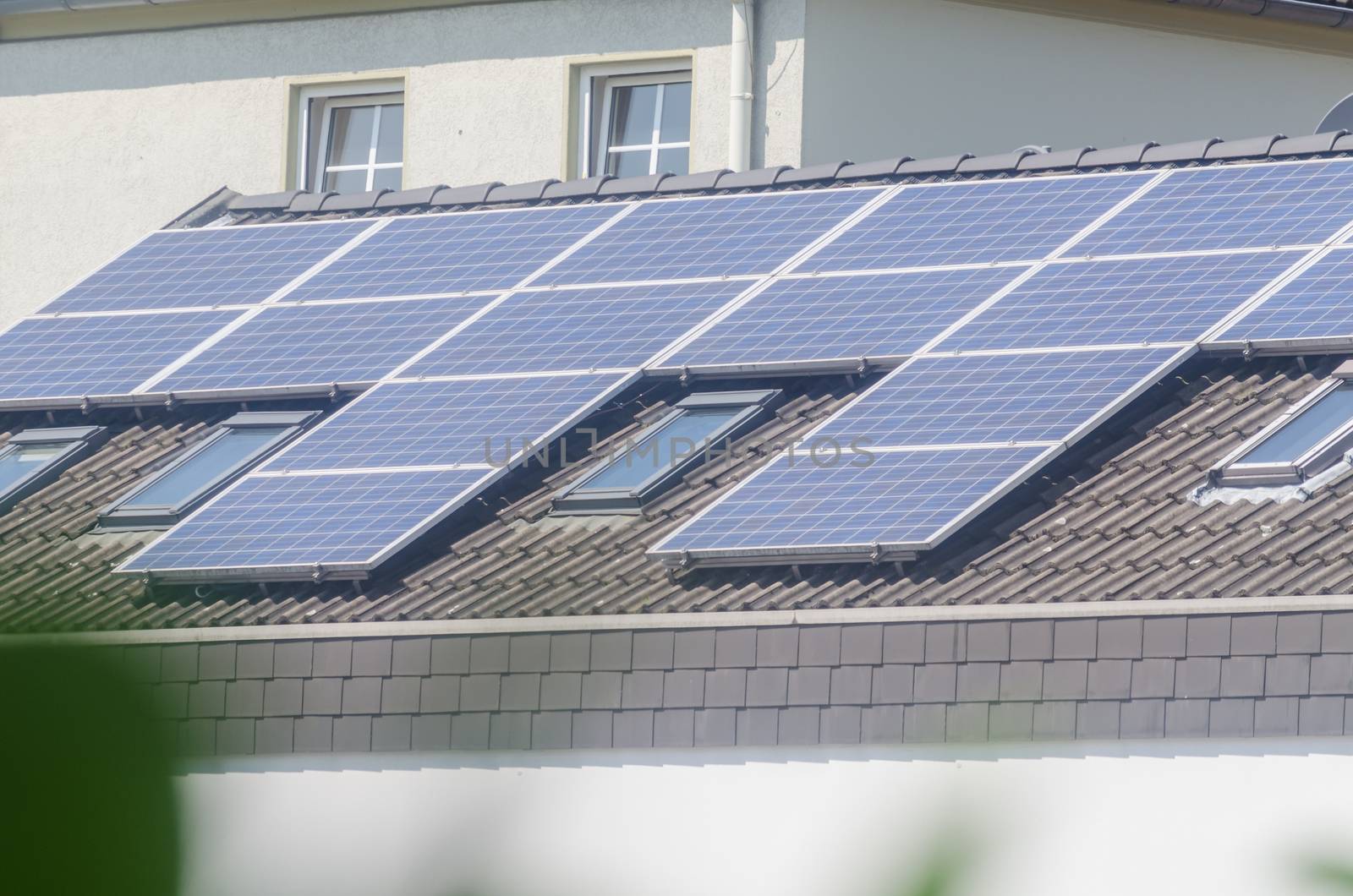 Renovated house, on the roof  a photovoltaic system.