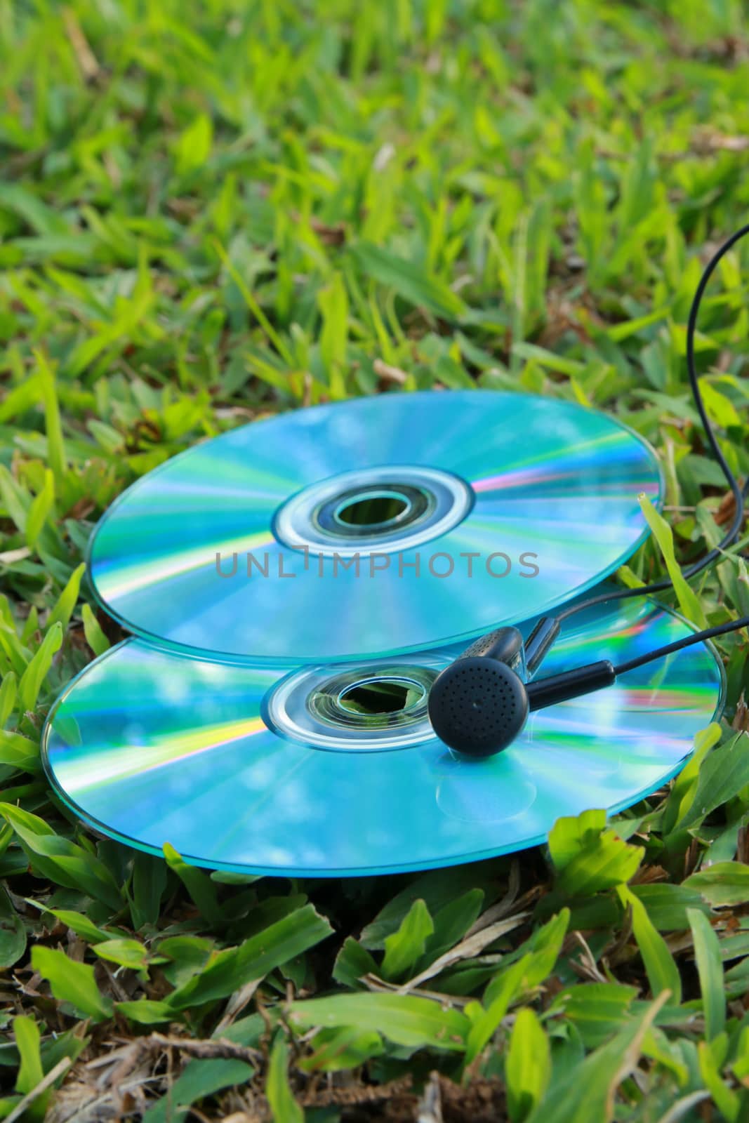 compact disc and earphone by kaidevil