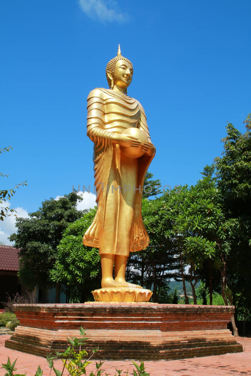 The large buddha image holding an alms bowl in the public temple in Thailand.
