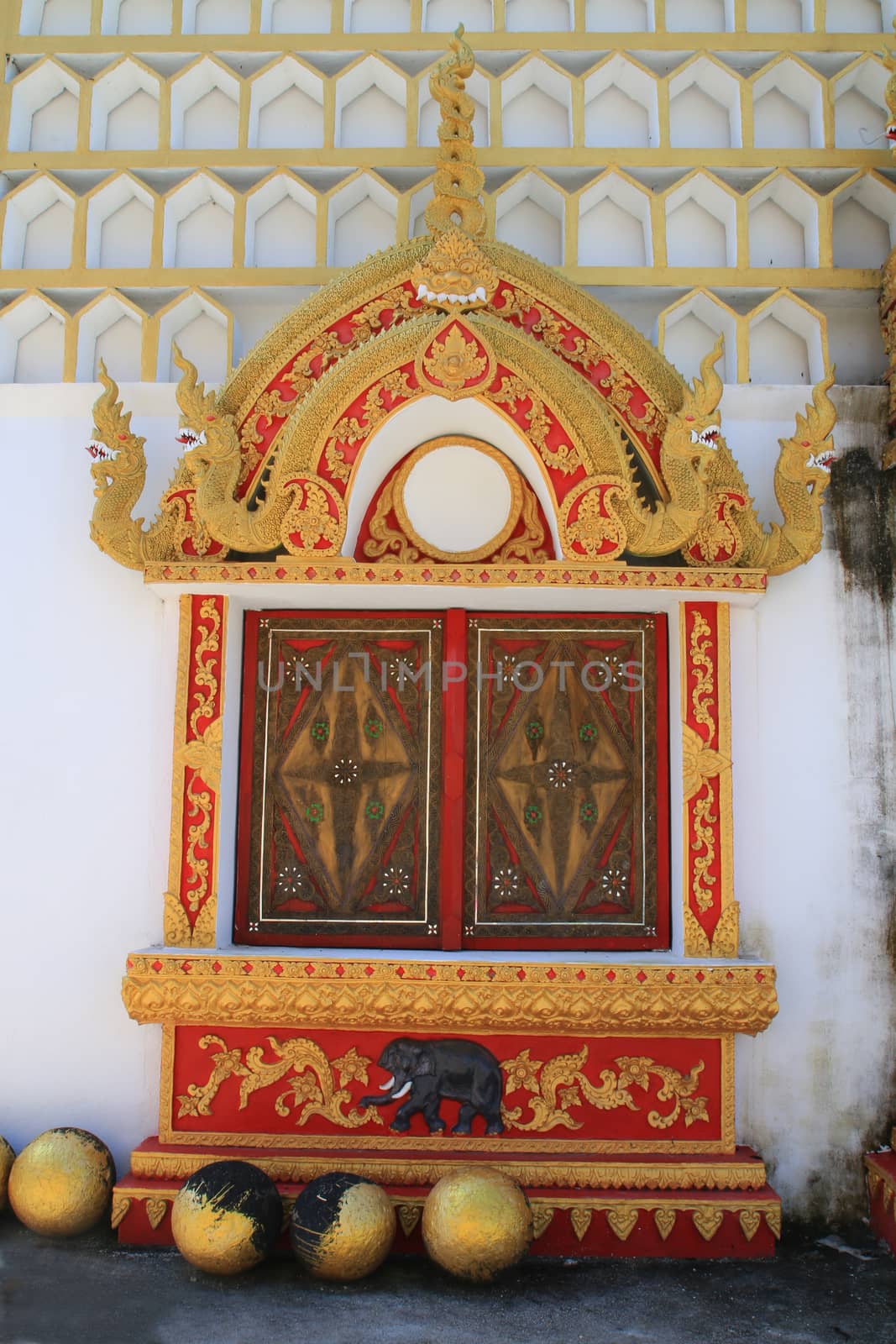 The window of the monastery decorated and design with Thai pattern in the public temple.