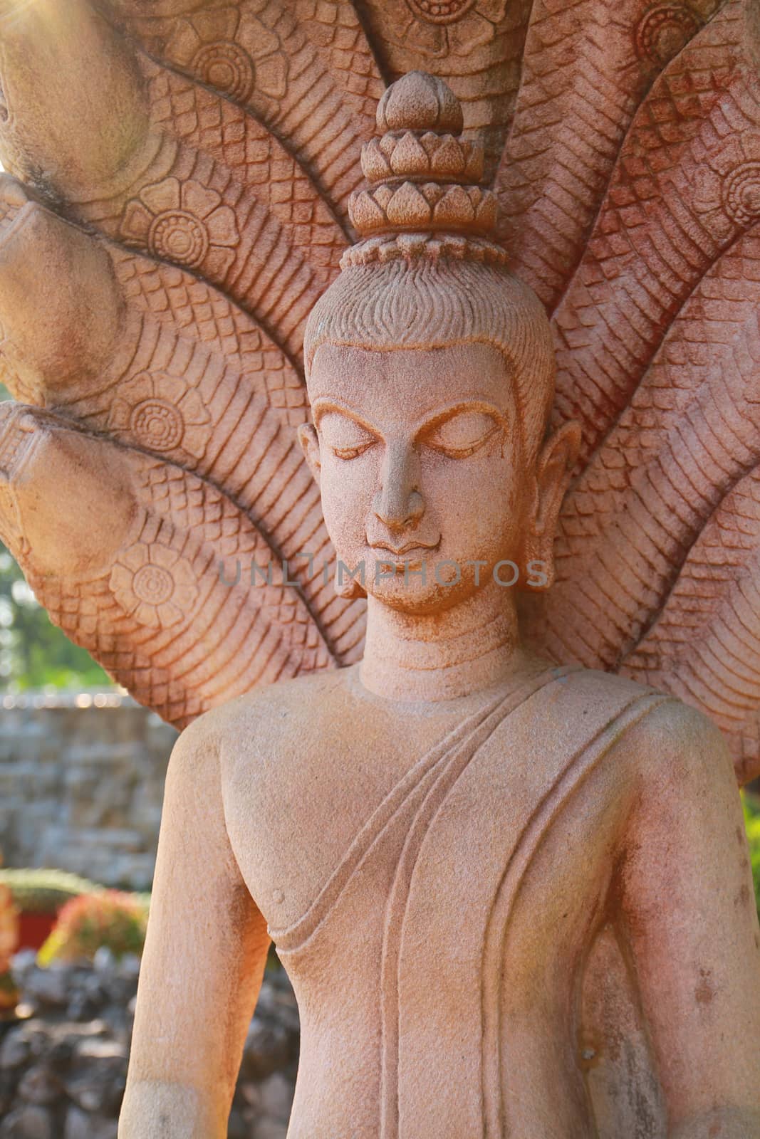 The image of buddha in public temple.This one created from stone.