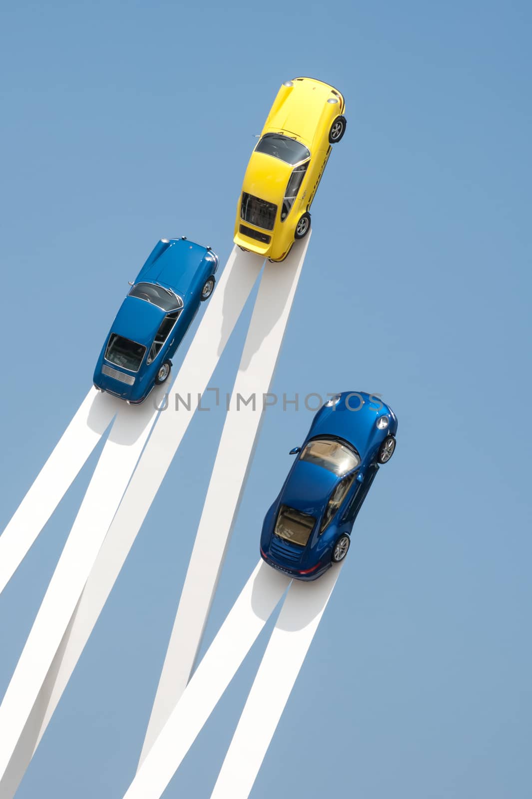 Goodwood, UK - July 13, 2013: Artistic exhibit of Porsche sports cars mounted on vertical platforms at the Festival of Speed event held at Goodwood, UK