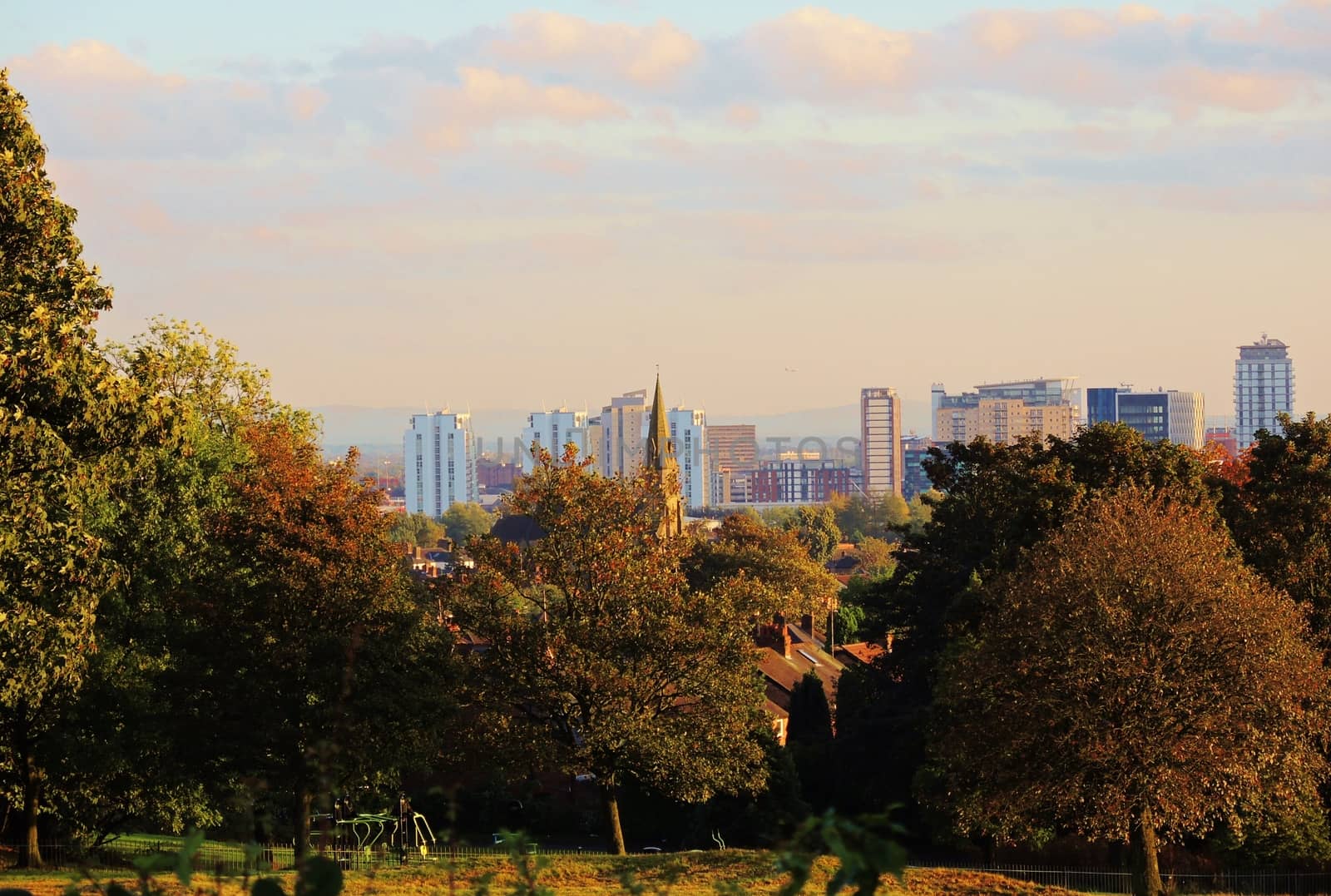 A colourful image of a City park in the Autumn.