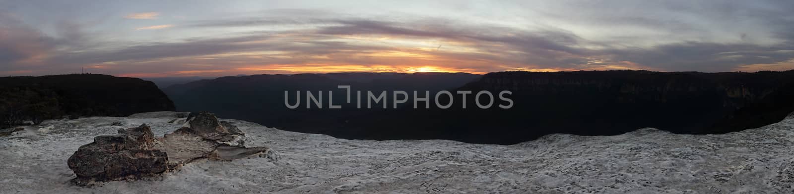 Sunset from Flat Rock, now renamed to Lincoln's Rock in honour of Lincoln Hall who survived Everest after being pronounced dead.  The rock juts out from the Kings Tableland at Wentworth Falls and overlooks Jamison Valley.  Panorama