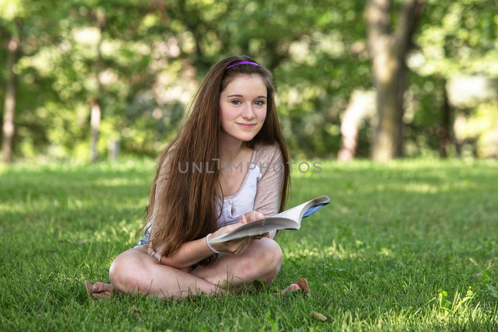 Cute Teen Studying by Creatista