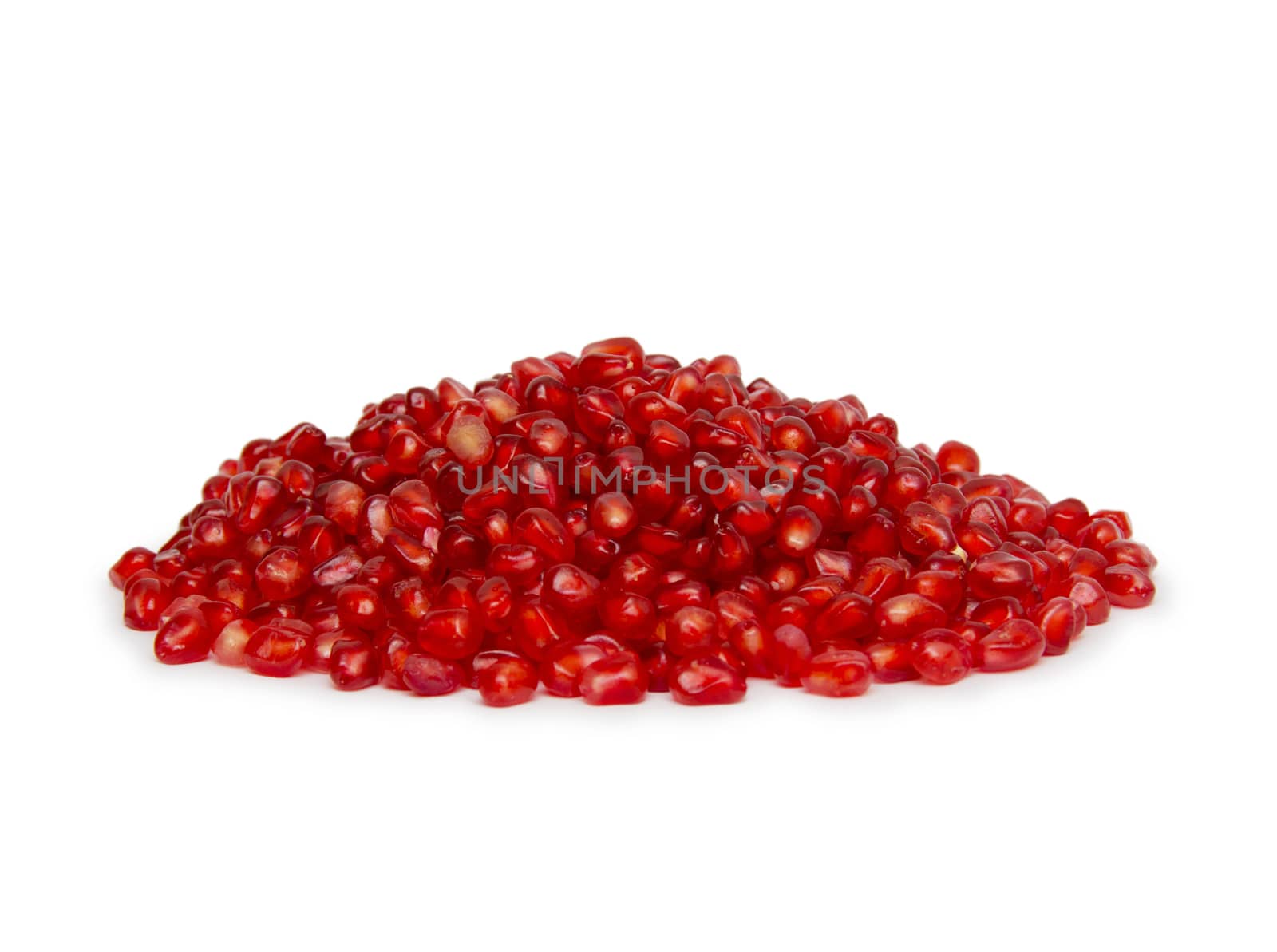 Pomegranate seeds on a white background.