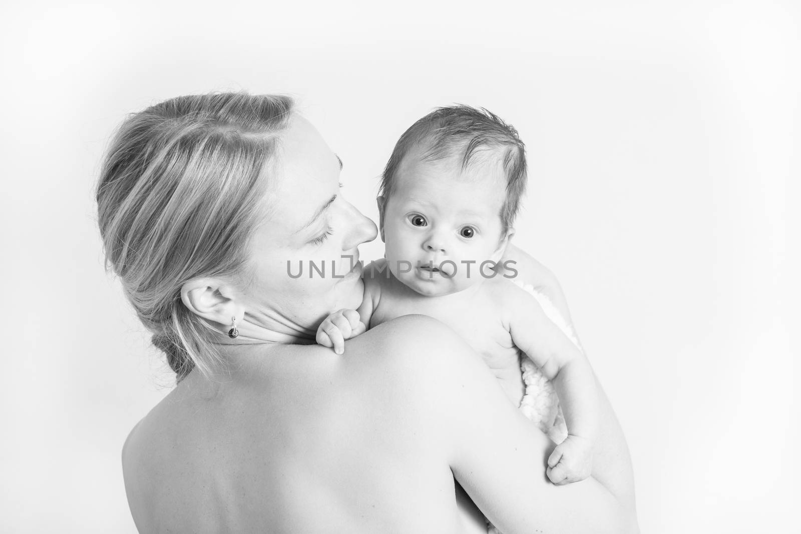 Black and white photo of a young mother holding her baby girl