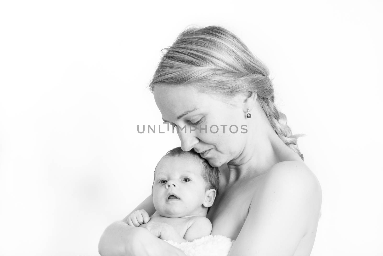 Black and white photo of a young mother holding her baby girl