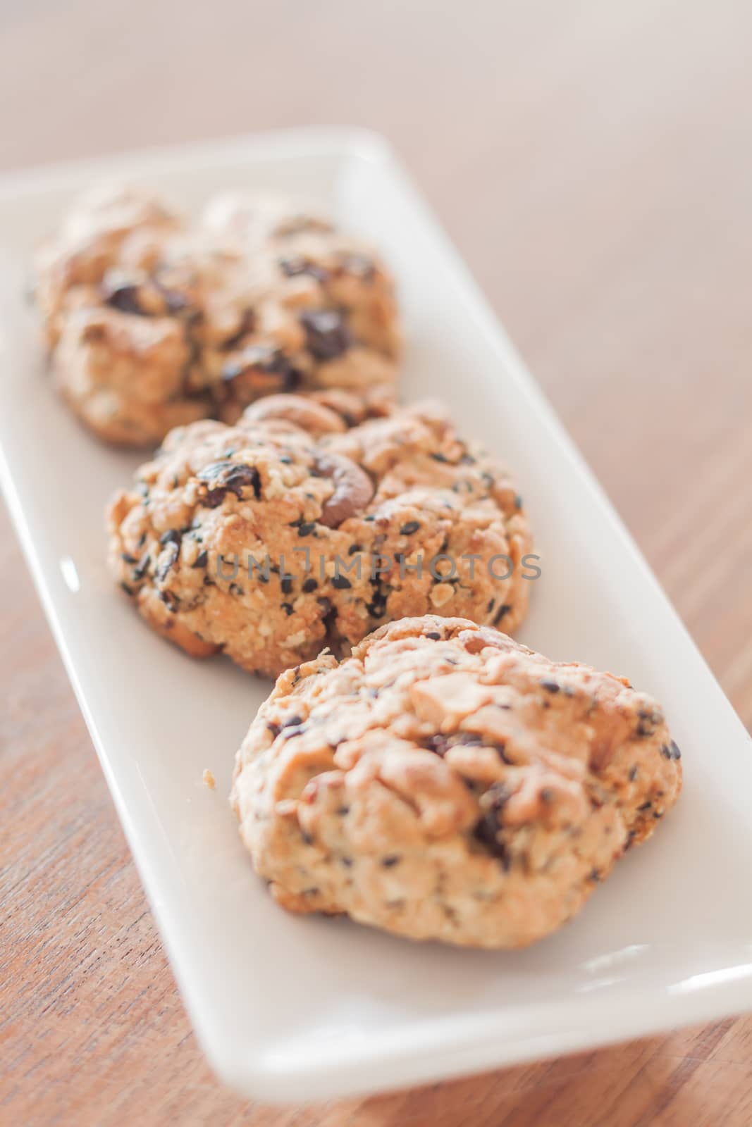 Closeup healthy cookies on white plate by punsayaporn