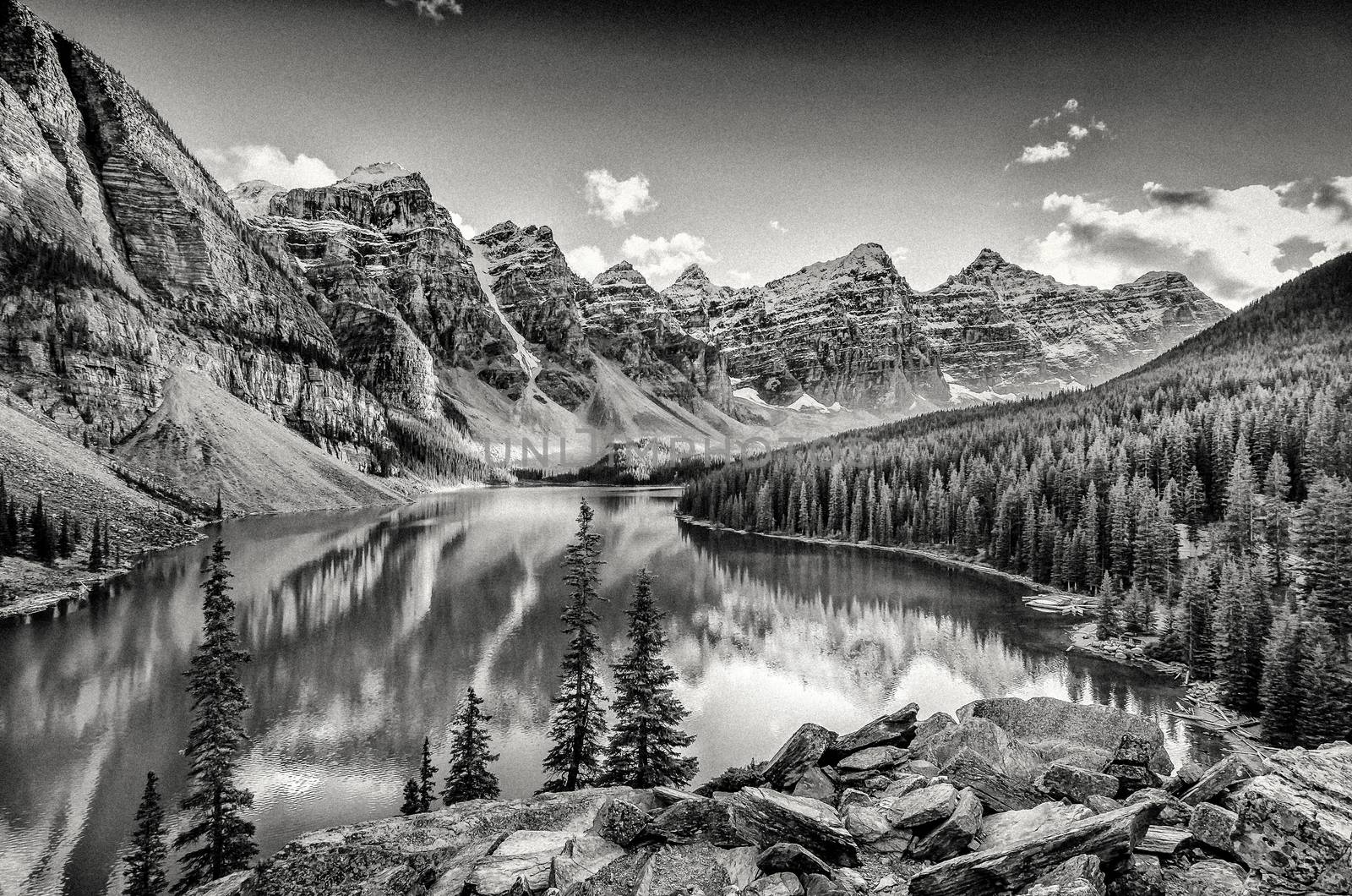 Monochrome filtered landscape view of Moraine lake and mountain range in Canadian Rocky Mountains