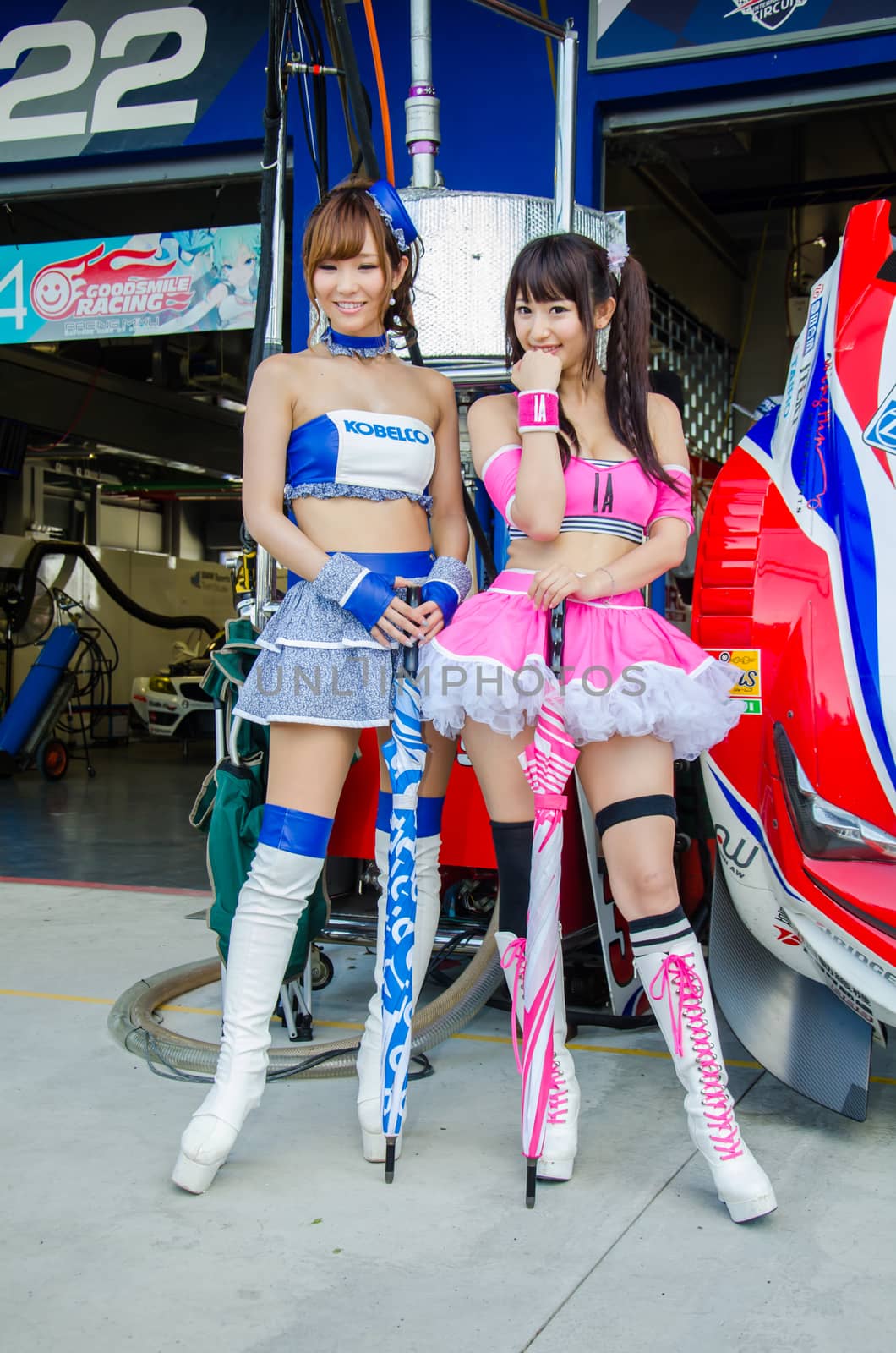 BURIRAM - OCTOBER 4: Unidentified  Race Queen of Japan with racing car on display at The 2014 Autobacs Super GT Series Race 7 on October 4, 2014 at Chang International Racing Circuit, Buriram Thailand