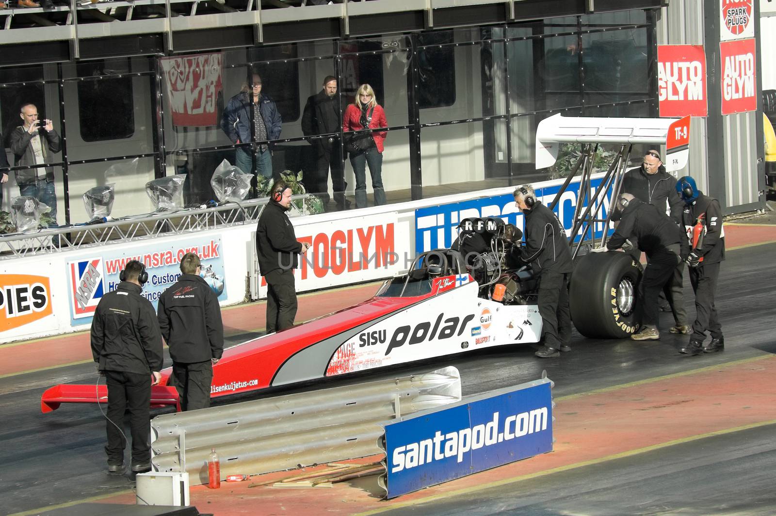 Santa Pod, UK - October 29, 2011: Engineers preparing the Susi Polar top fuel dragster for a run at the Flame and Thunder event at Santa Pod Raceway in Northamptonshire, UK