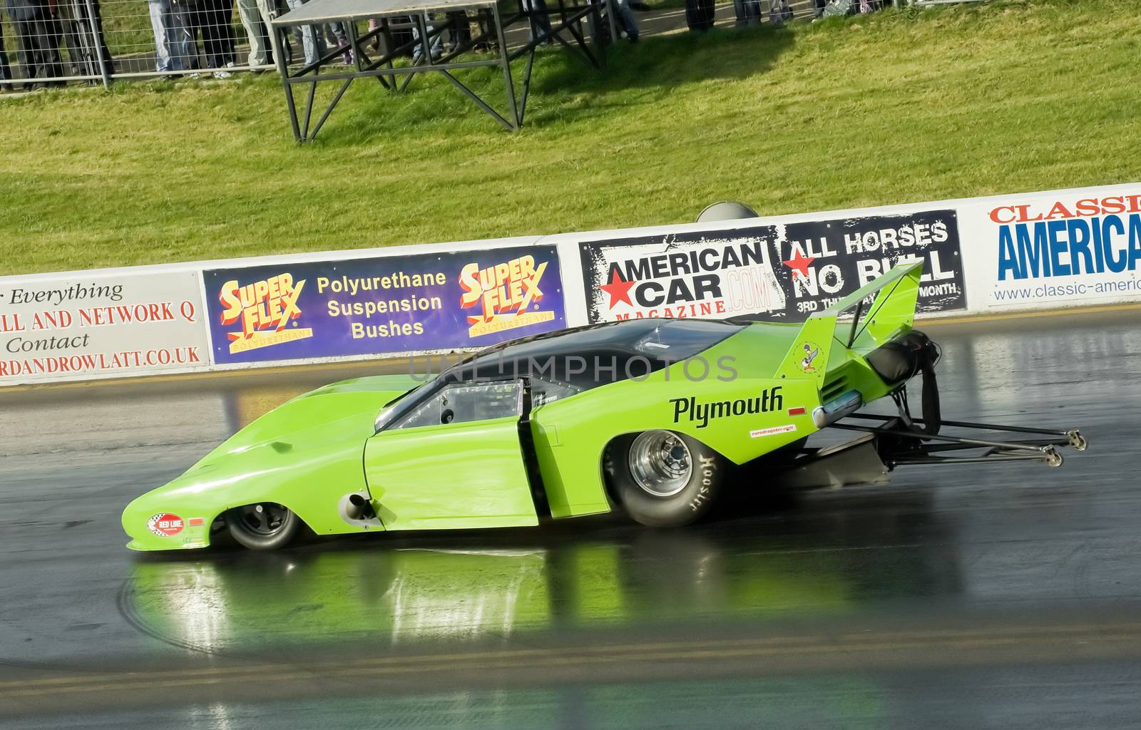 Santa Pod, UK - October 29, 2011: Sleek Plymouth funny car dragster on the strip at the Flame and Thunder event at Santa Pod Raceway in Northamptonshire, UK