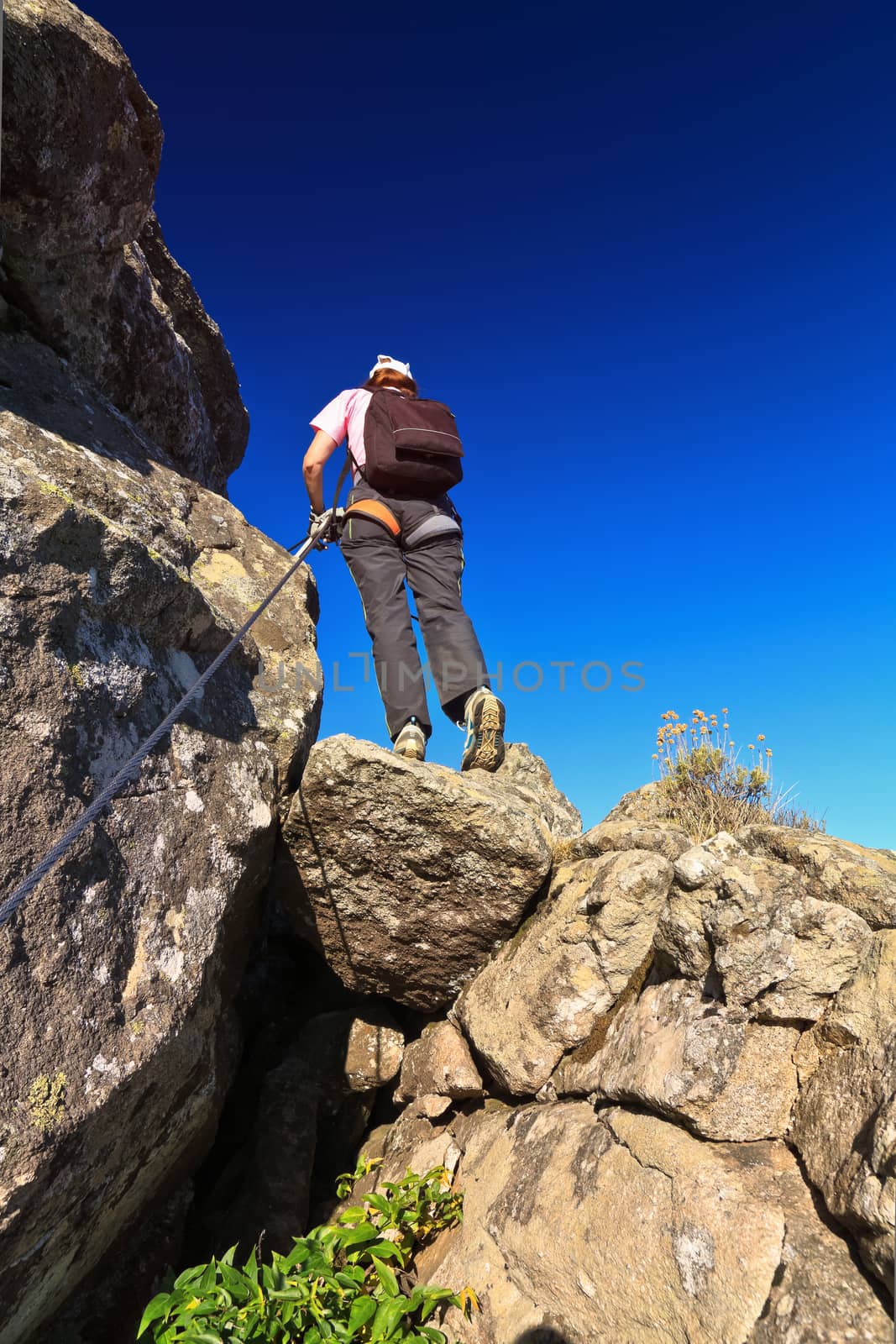 woman on via Fearrata in Capanne mount, Elba island, Italy