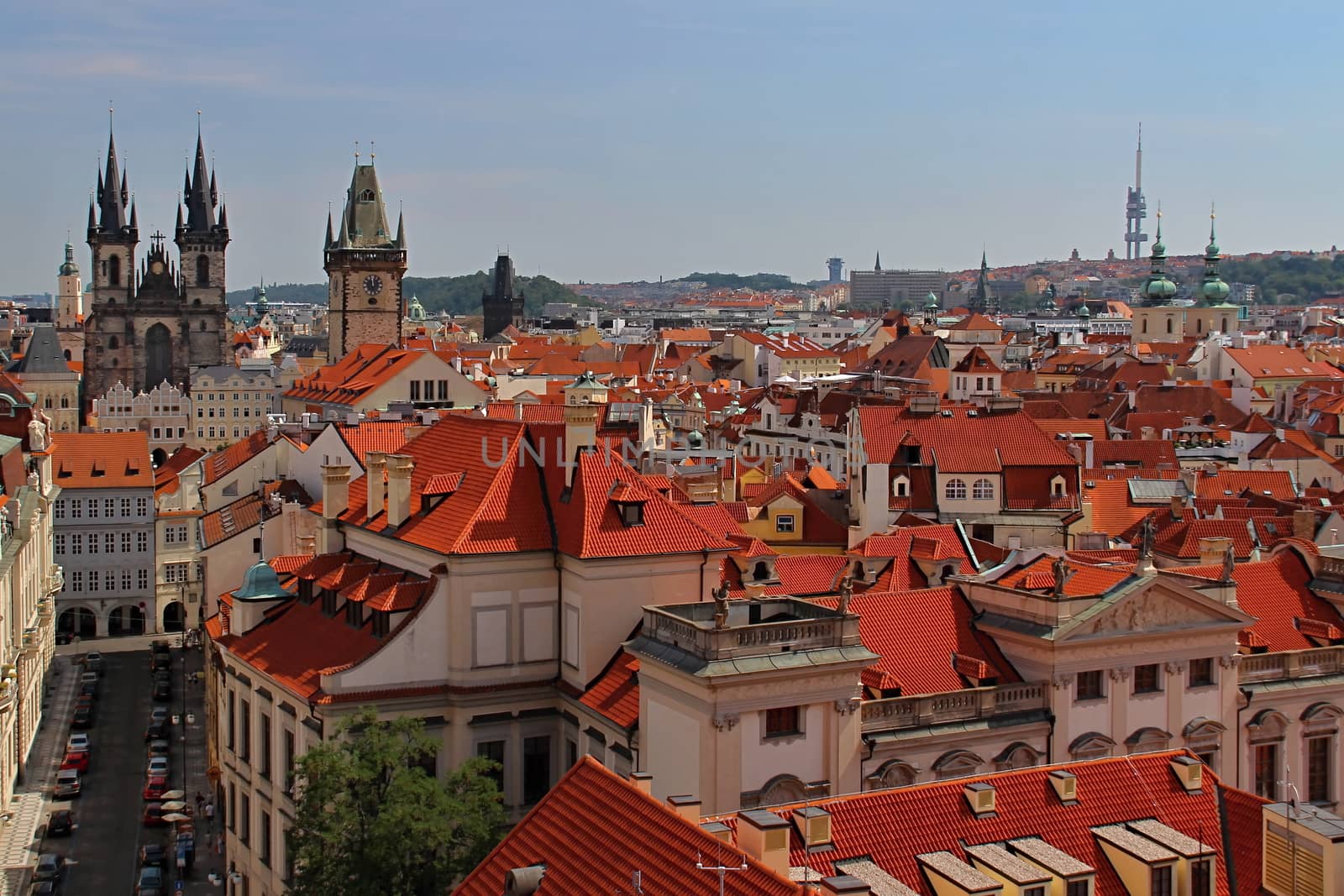 Photo shows details of Prague red roofs and old houses.