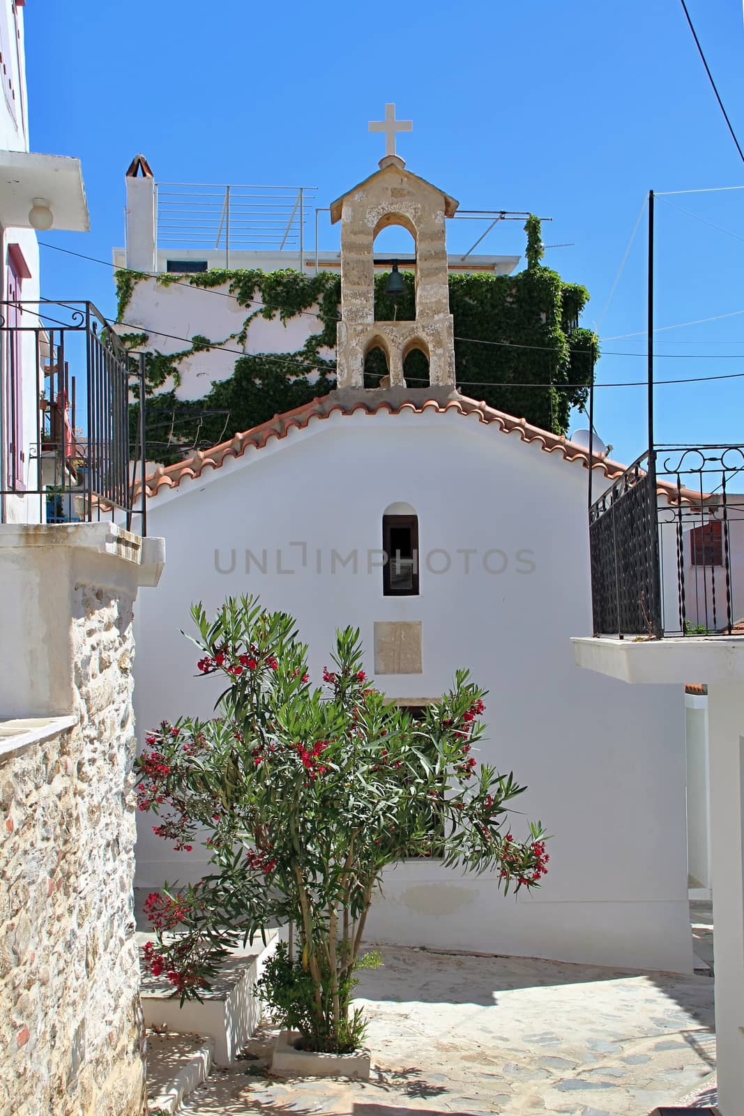 Photo shows Greek old village houses and their surroundings.