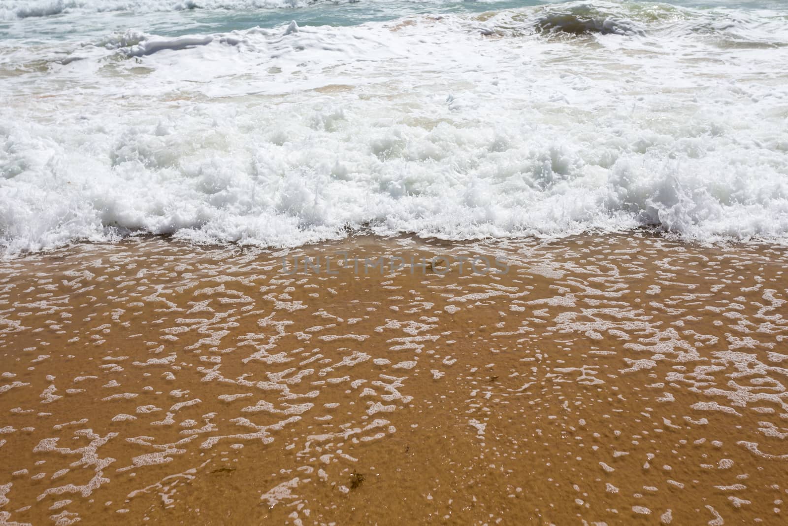 Beautiful clear mediterranean water lapping on the shore