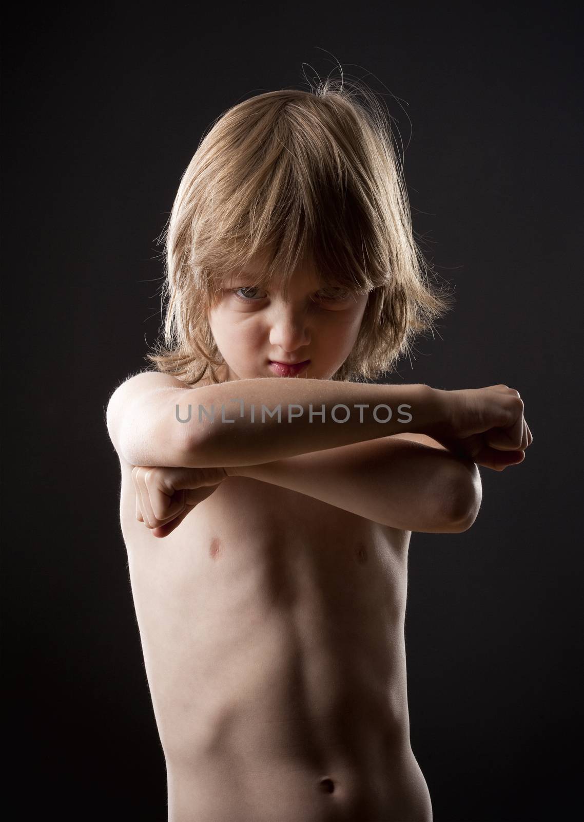 Boy Striking a Fighting Pose by courtyardpix