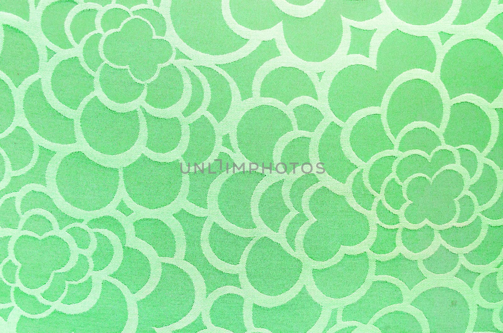 Abstract green circle fabric texture and background.