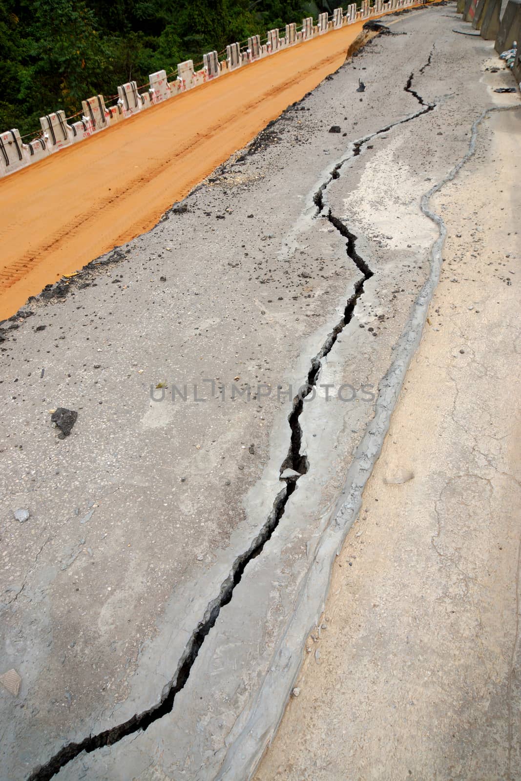 the asphalt road surface crack due to ground collapsing.