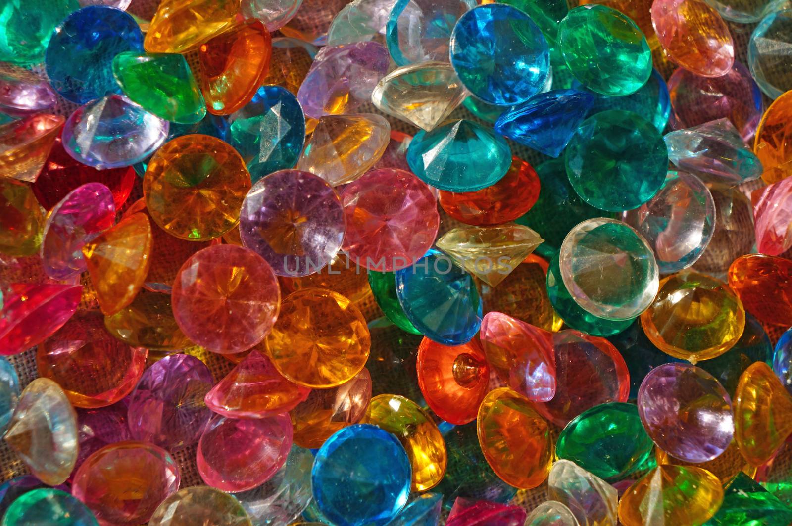 Colored Crystal Rhinestones close up as background                               